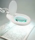 Lamp with magnifying glass and clamp