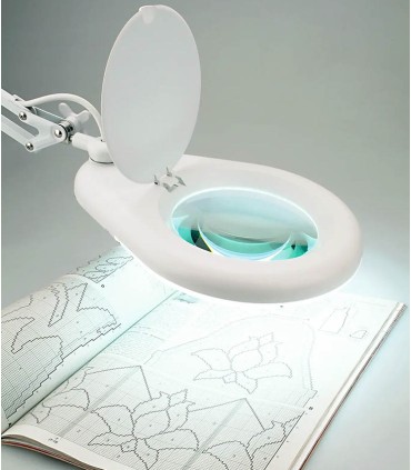 Lamp with magnifying glass and clamp